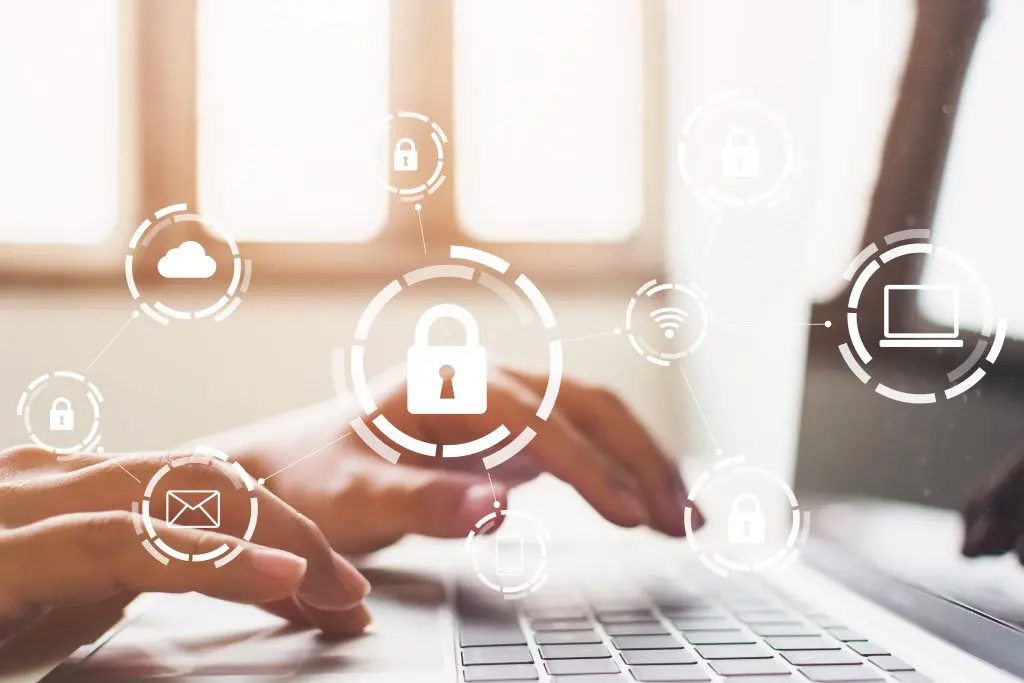 A digital security illustration over a laptop keyboard.