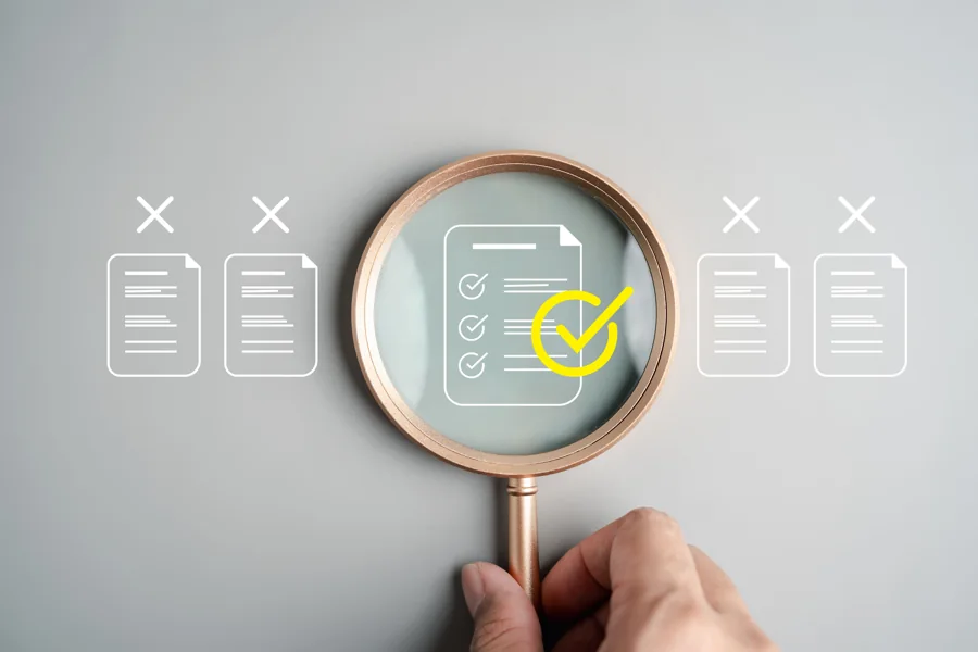 Magnifying glass over a document checklist